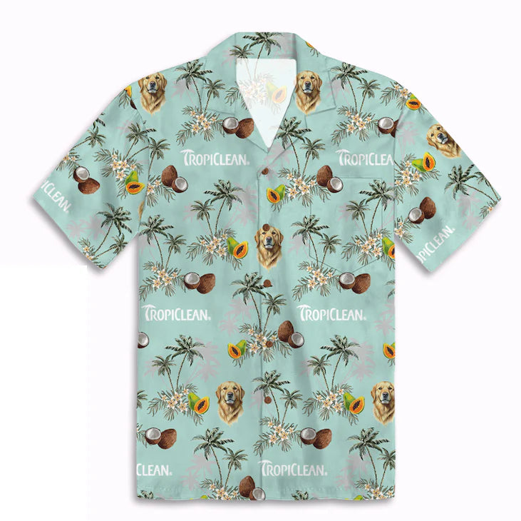 Hawaiian-style shirt with tropical pattern and 'TropiClean' branding on a light blue background
