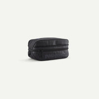Black toiletry bag with Patagonia logo on a white background