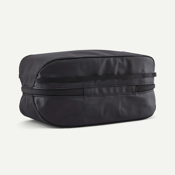 Black washbag/toiletry bag with zip closure on a white background