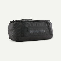 Black duffel bag with Patagonia logo on a white background