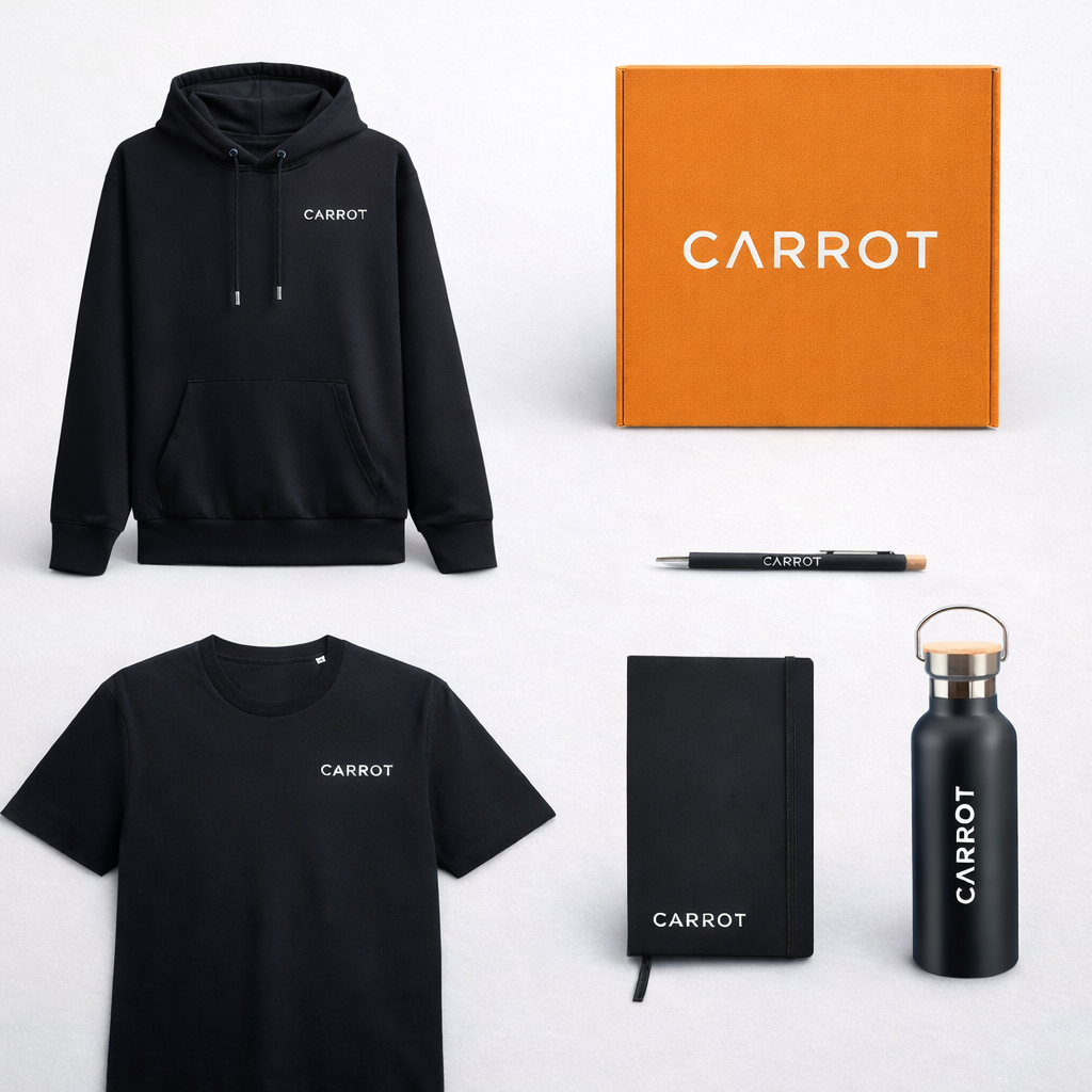 Collection of black CARROT-branded merchandise including a hoodie, t-shirt, notebook, pen, and water bottle on a white background.