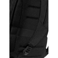 Close-up of a black backpack with padding and straps on a white background