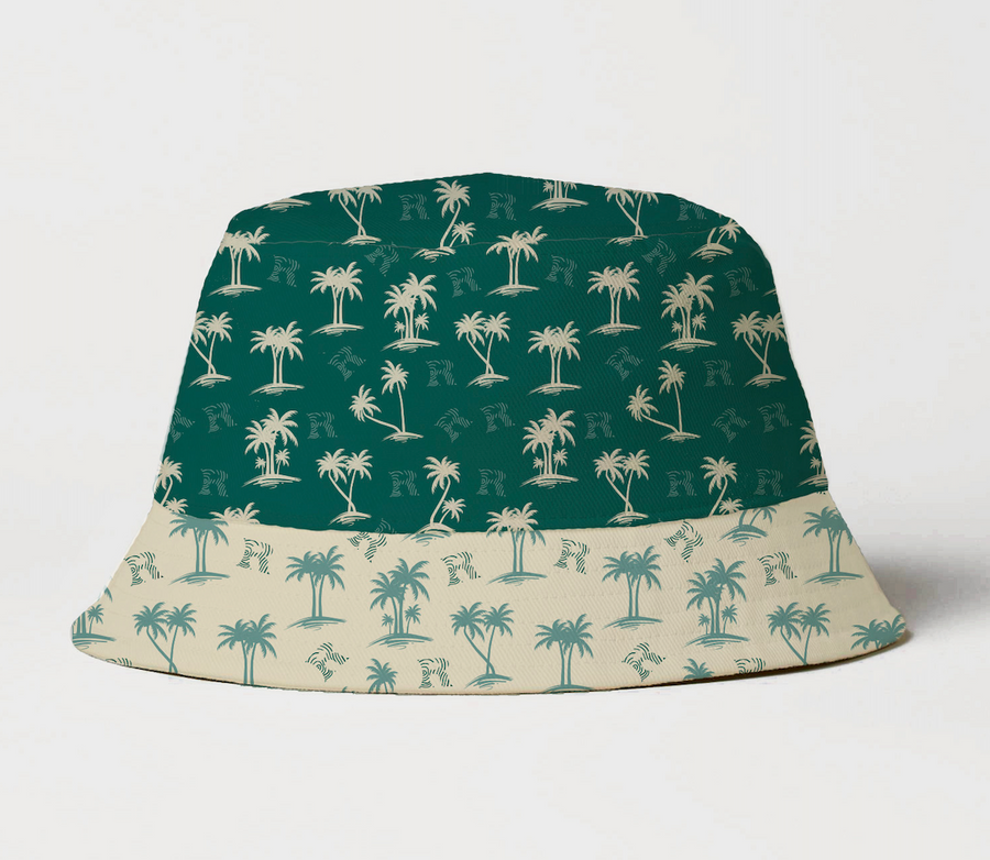 Bucket hat with palm tree pattern on green and beige background