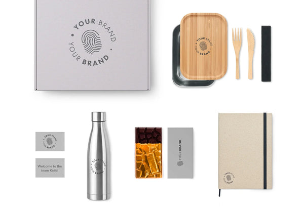 Branded swag box with lunchbox, water bottle, notebook, and welcome card