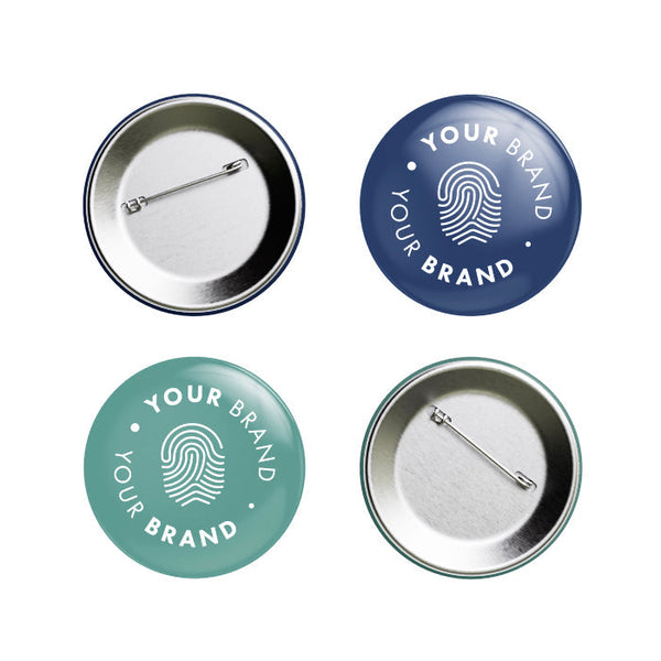 Branded pin badges in navy and sage green