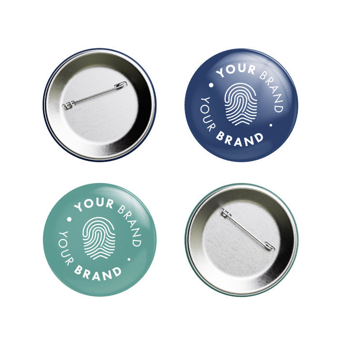 Branded pin badges in navy and sage green