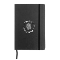 Custom branded charcoal hardcover journal with elastic closure and company logo on cover
