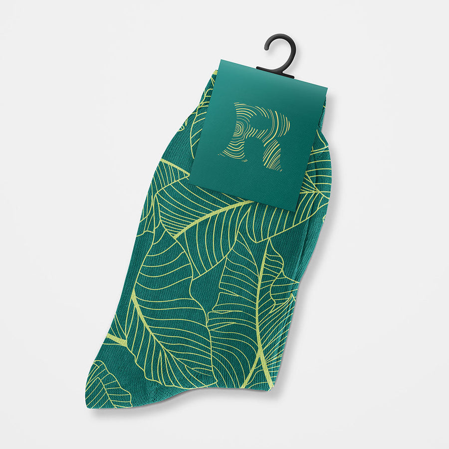Custom Socks with green and yellow leaf pattern and customizable label for branding or gifts.
